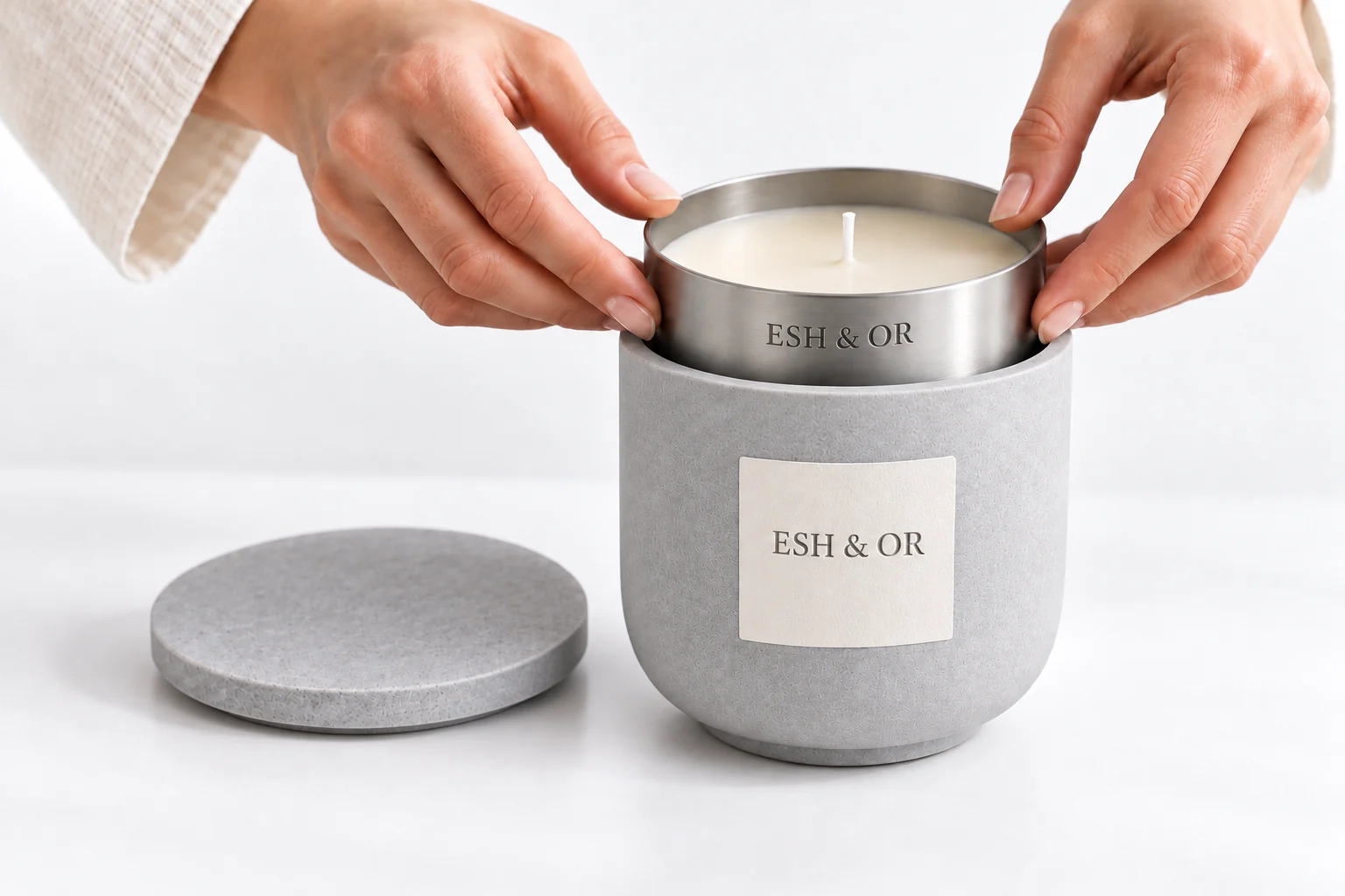 Hands inserting a refill into the correctly proportioned concrete vessel